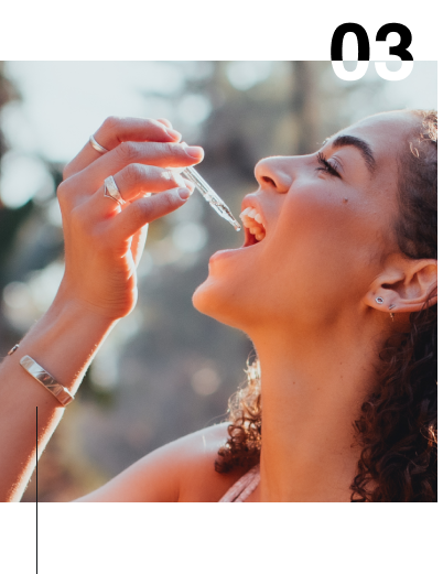 woman placing nurish CBD drops in mouth